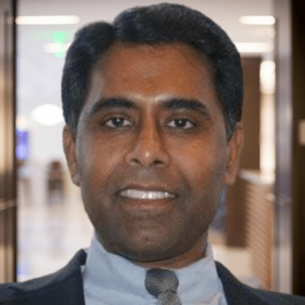 Portrait of a smiling man indoors.